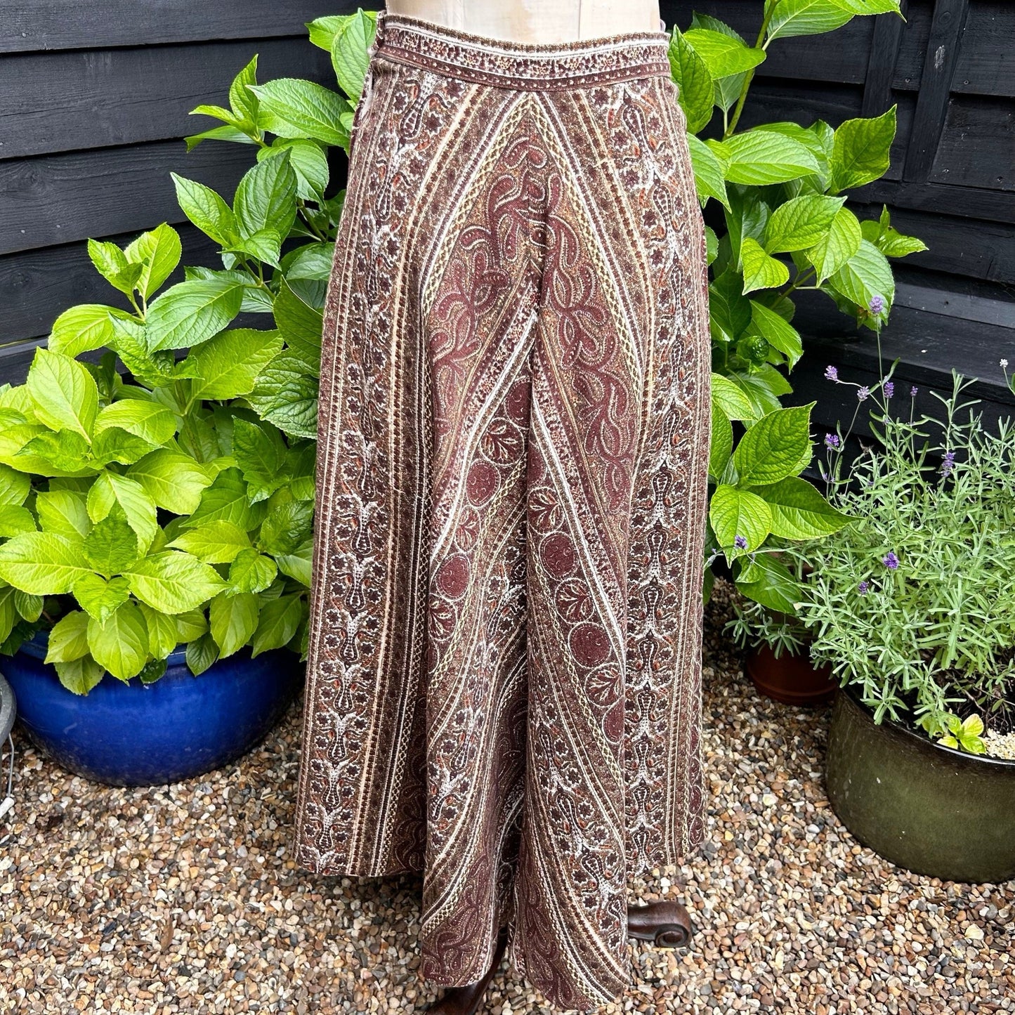 1970s Liberty of London brown patterned fabric A Line Skirt by Marion Donaldson in garden setting - Splendid Vintage World