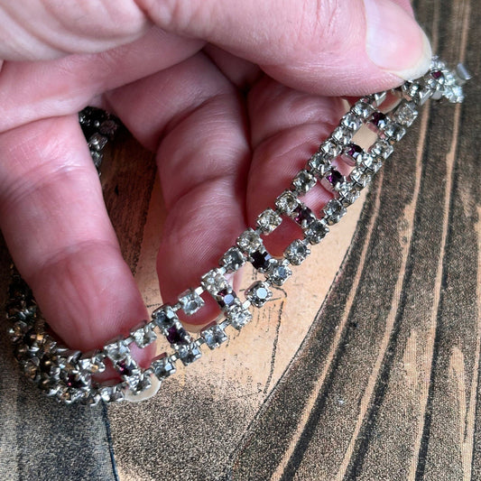Vintage diamanté bracelet clear & amethyst paste held by hand on printed background- Splendid Vintage World