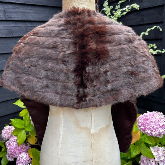 back view of Vintage Fur Stole Reddish Brown in colour on a mannequin in a garden - Splendid Vintage World