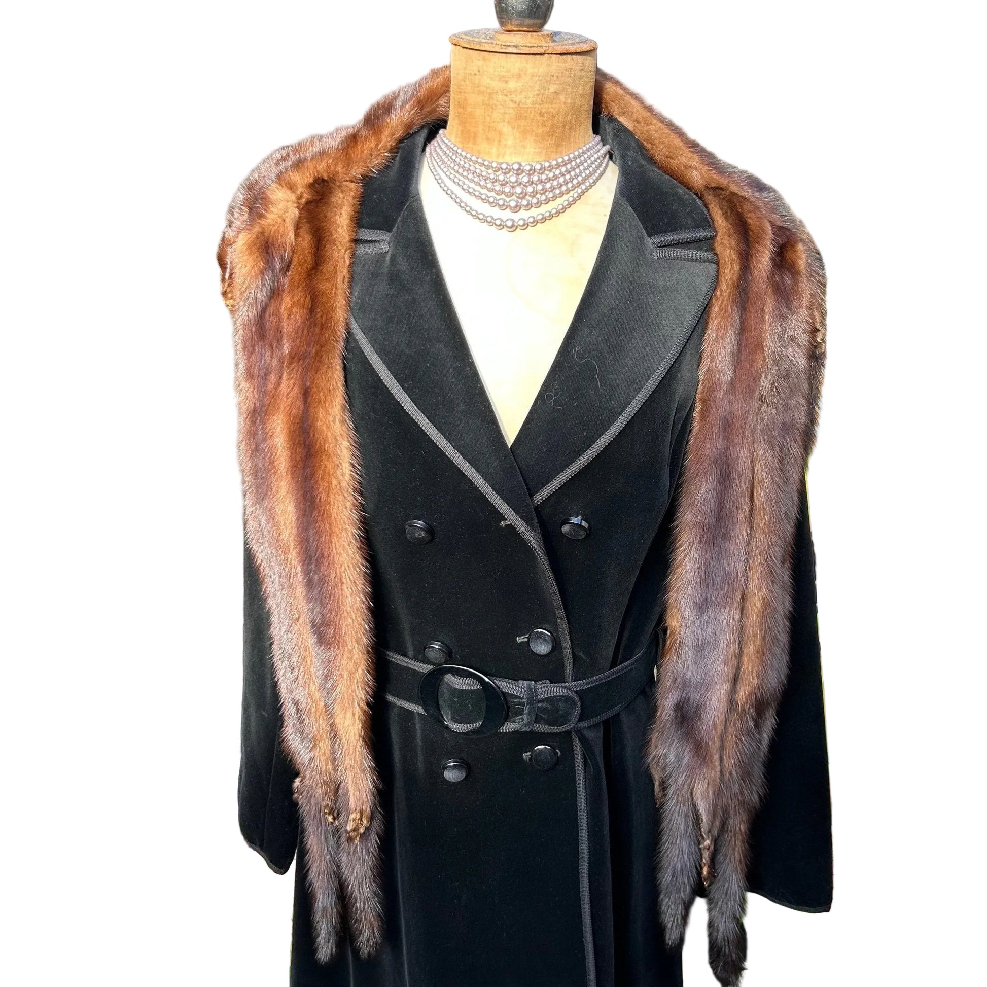 Vintage mink fur stole tippet draped around shoulders of a black coat on a mannequin on white ground- Splendid Vintage World