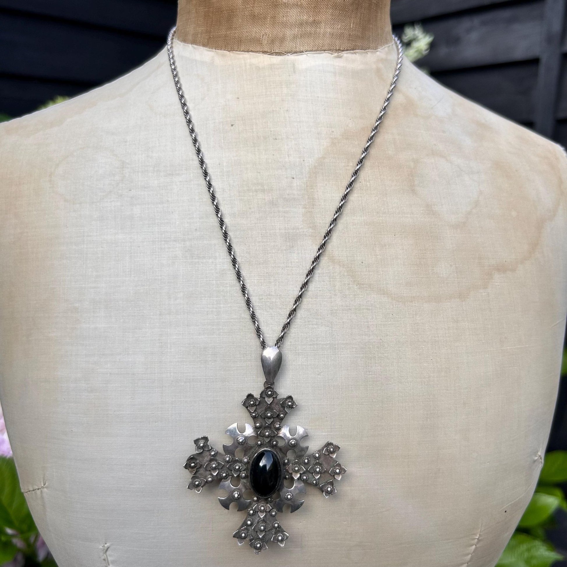 Vintage ornate silver cross pendant with black cabochon on silver chain -on mannequin - Splendid Vintage World