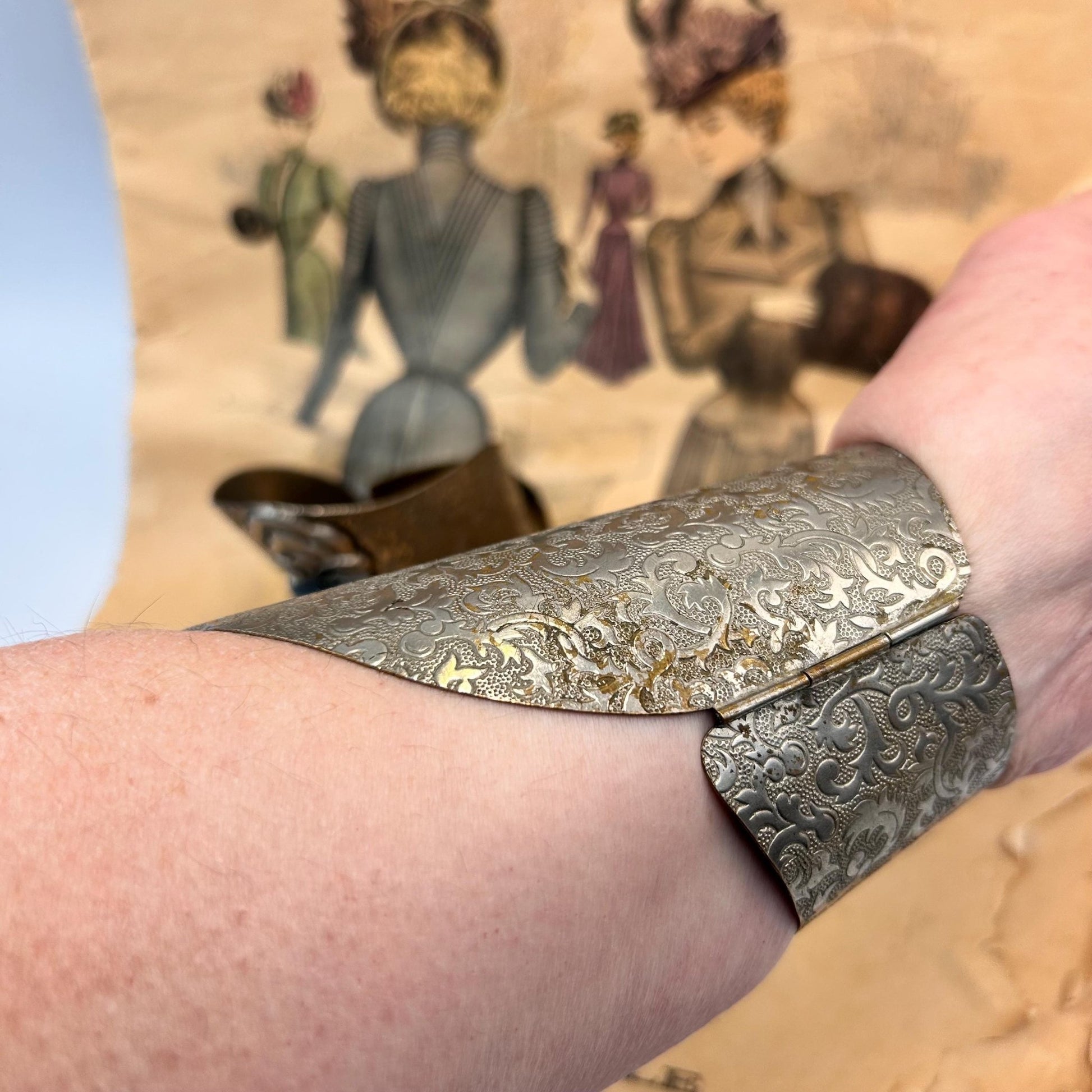 Pair of Vintage Art Deco style metal cuffs or bracelets with etched foliage pattern & applied metal & black glass detailing