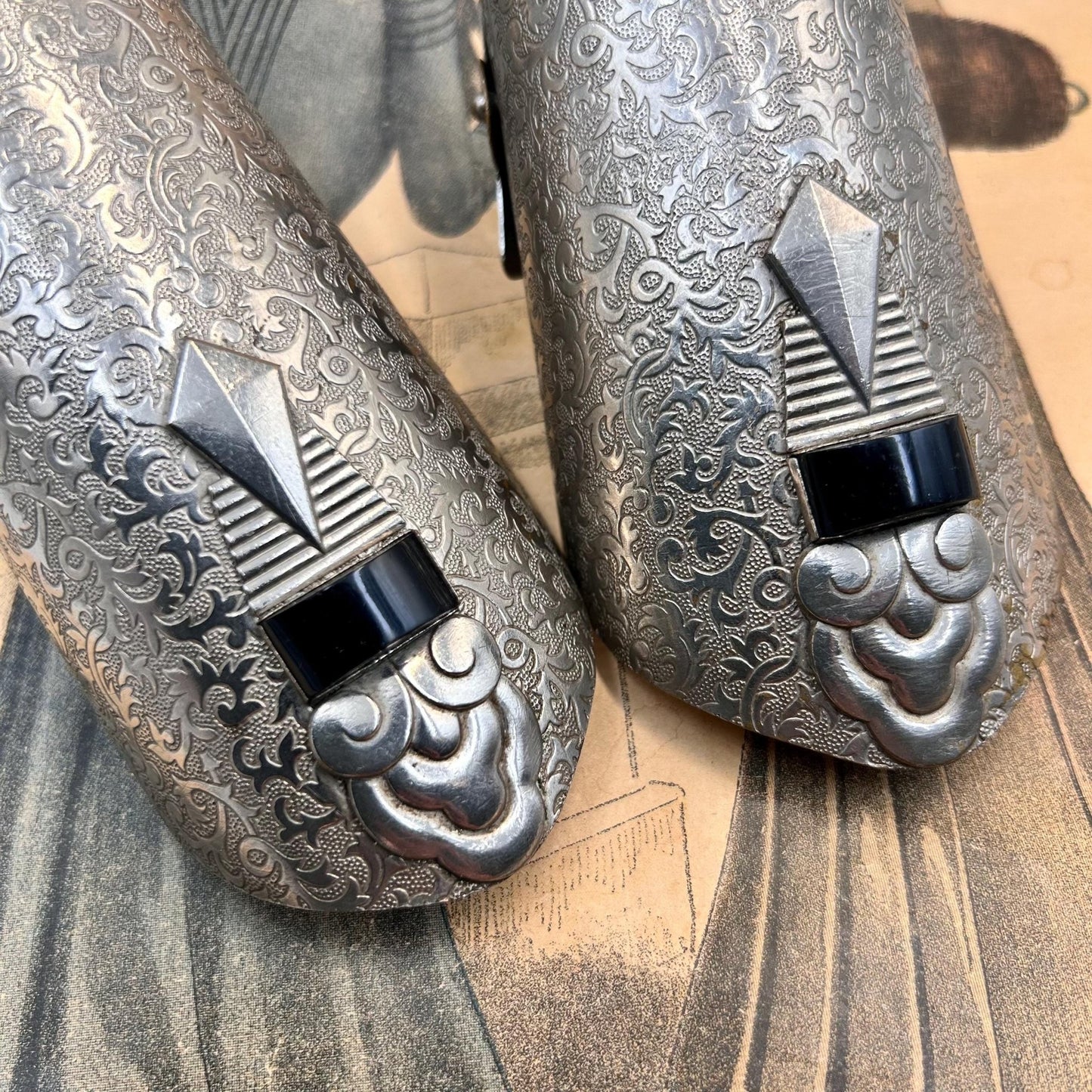 Pair of Vintage Art Deco style metal cuffs or bracelets with etched foliage pattern & applied metal & black glass detailing