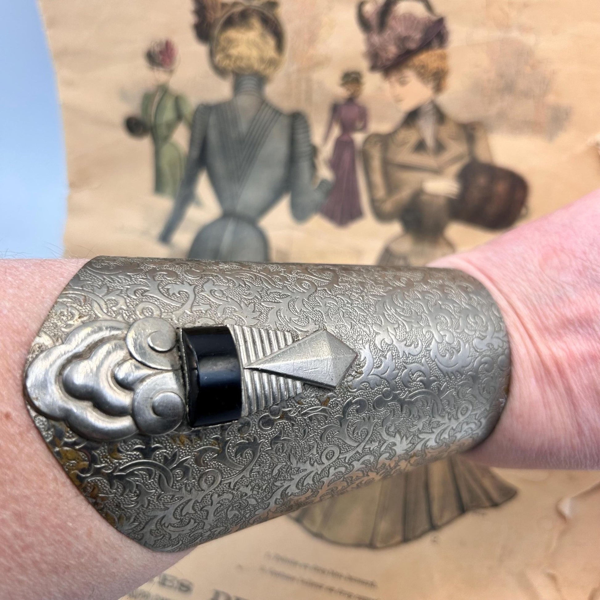 Pair of Vintage Art Deco style metal cuffs or bracelets with etched foliage pattern & applied metal & black glass detailing