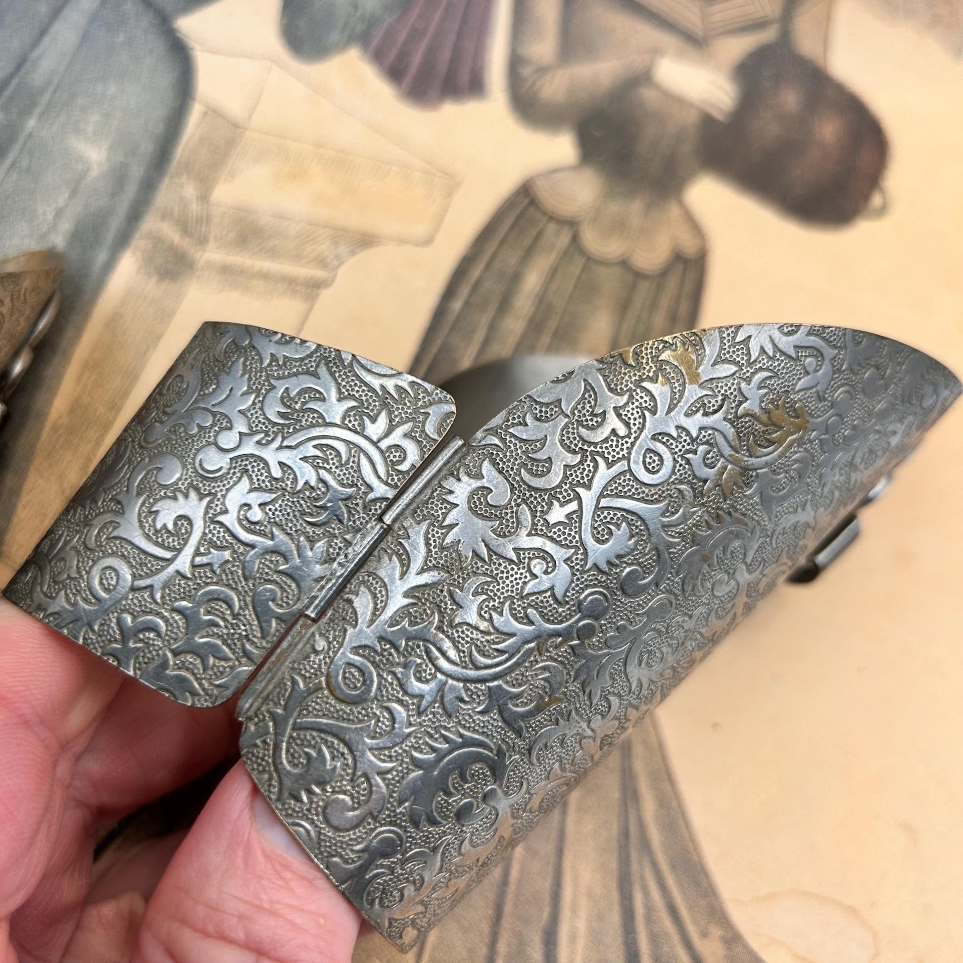Pair of Vintage Art Deco style metal cuffs or bracelets with etched foliage pattern & applied metal & black glass detailing