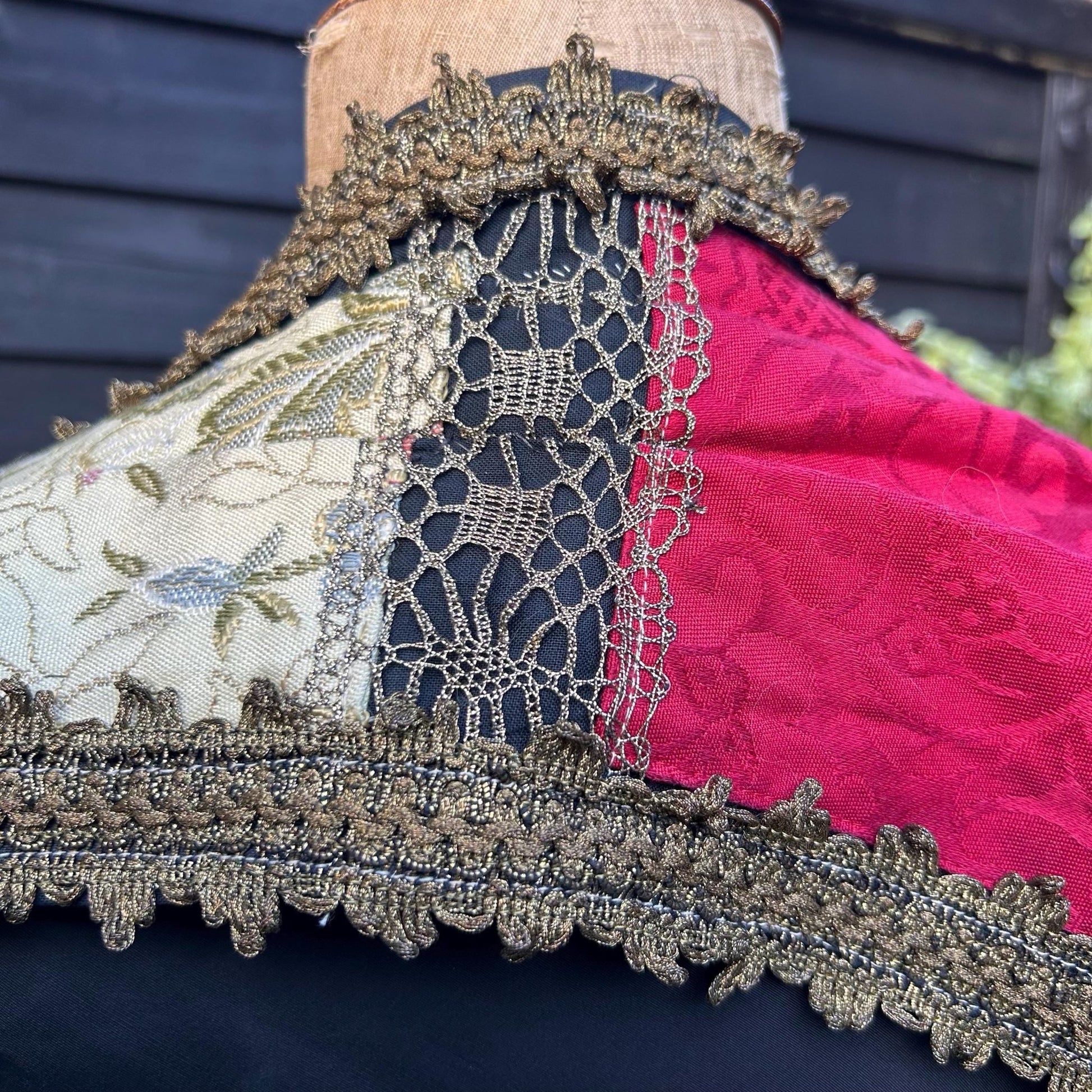 Gold Metallic Trim with patterned red fabric to right & patterned beige fabric to left against black - Splendid Vintage World